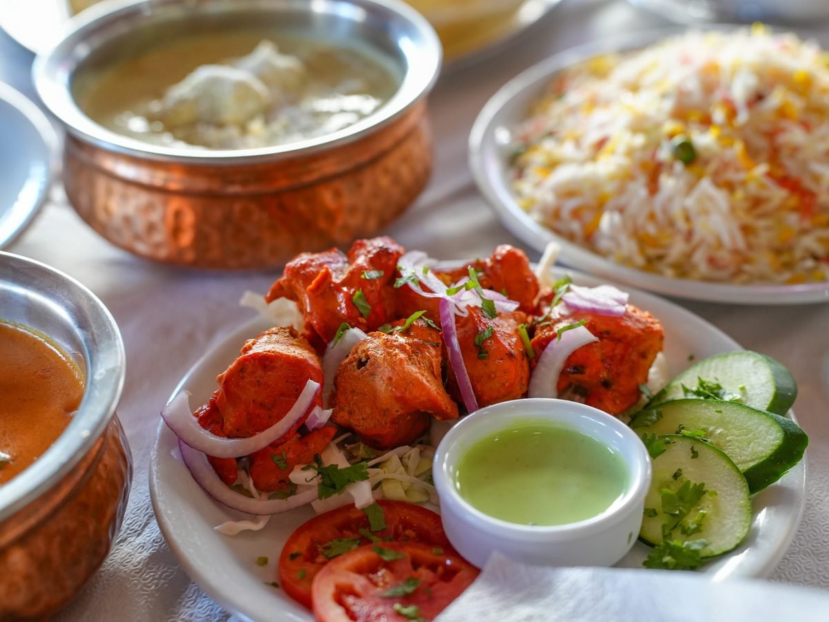 A tandoori platter with salad and mint dip
